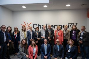 Group photo of the ChallengeEU delegation standing in front of a wall with the ChallengeEU logo at ECAM LaSalle