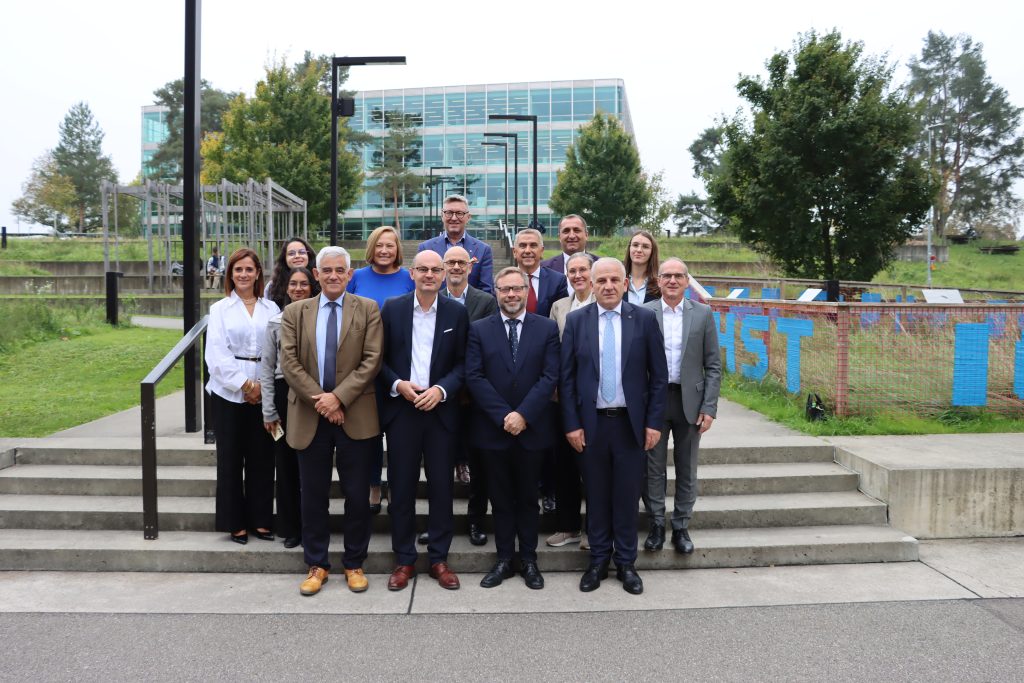 Group portrait of Strategy Board members standing on steps outside an FHNW campus building