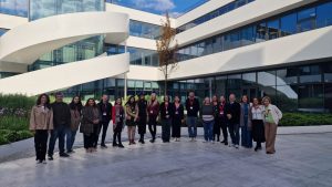 Group photo of participants standing outside a modern university building during a ChallengeEU training event.