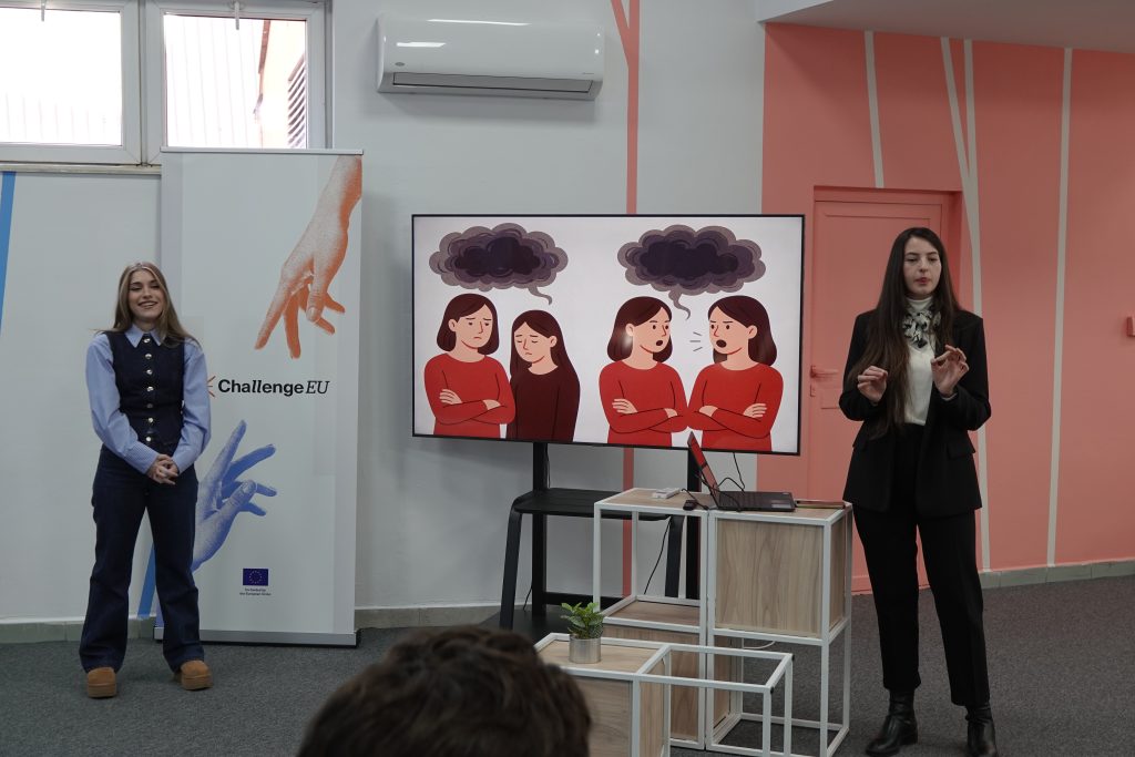 Two students use visual storytelling to discuss emotional and psychological aspects of family law, engaging the audience.