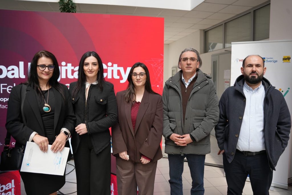 Close group portrait of representatives and partners posing at the Global Digital City event venue.