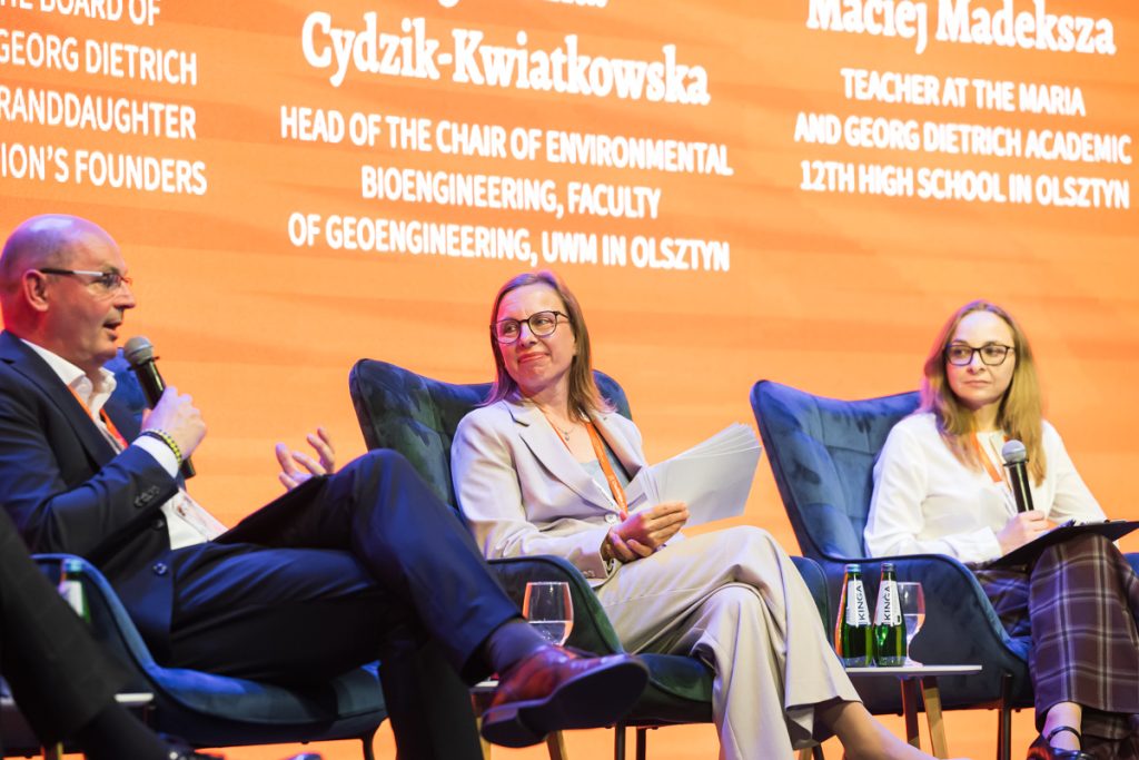 Panel discussion during the ChallengeEU 1st Annual Conference, with speakers seated on stage and one panellist speaking into a microphone