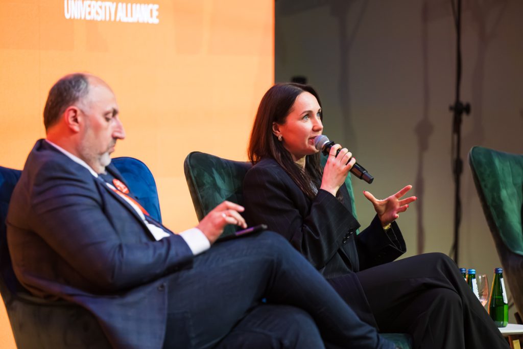 Panel discussion during the ChallengeEU 1st Annual Conference, with speakers seated on stage and one panellist speaking into a microphone
