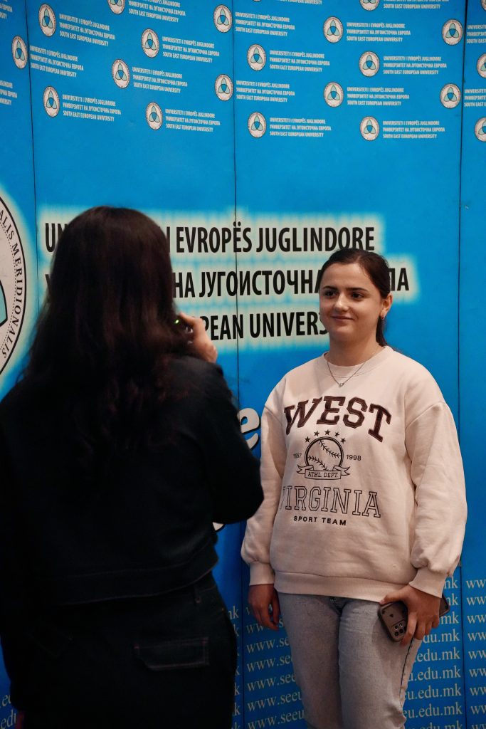 The picture shows two young women that recording an interview in the SEEU's event dedicated to young people's mental health. 