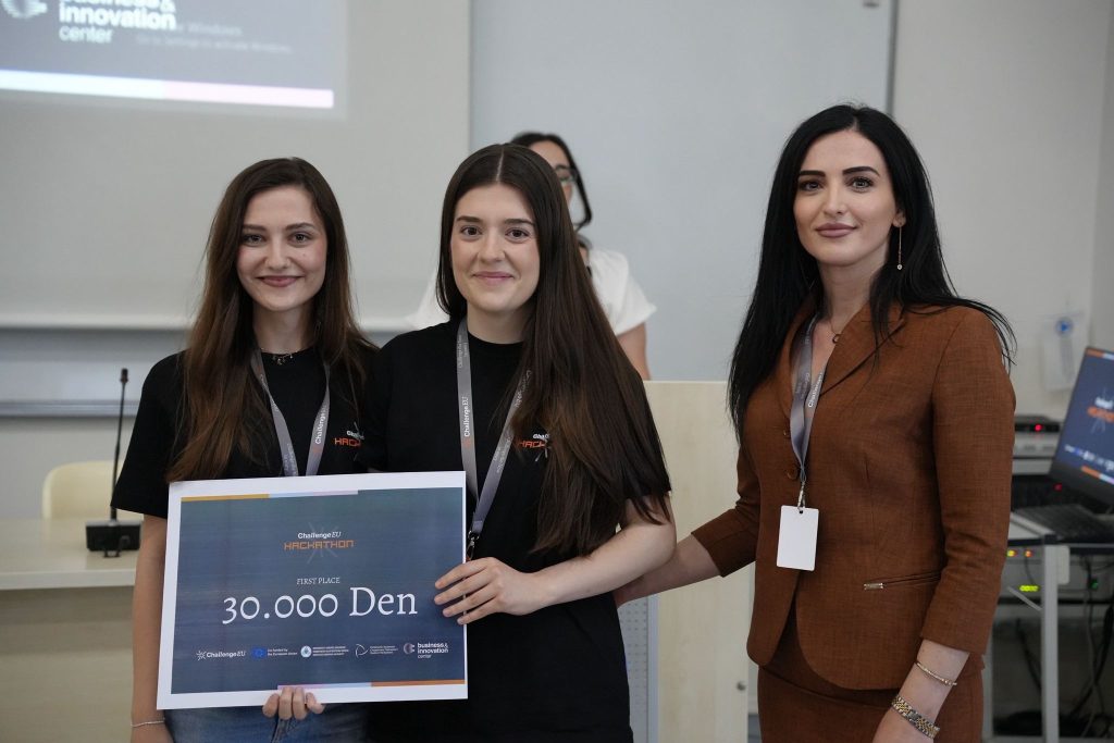 The first-place winning team poses with a 30,000 denar award certificate at the ChallengeEU Hackathon.
