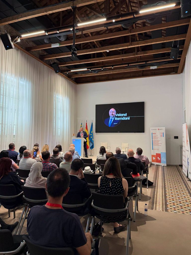 A wide view of the ISCBE 2026 conference room, showing participants attending a presentation in Valencia.