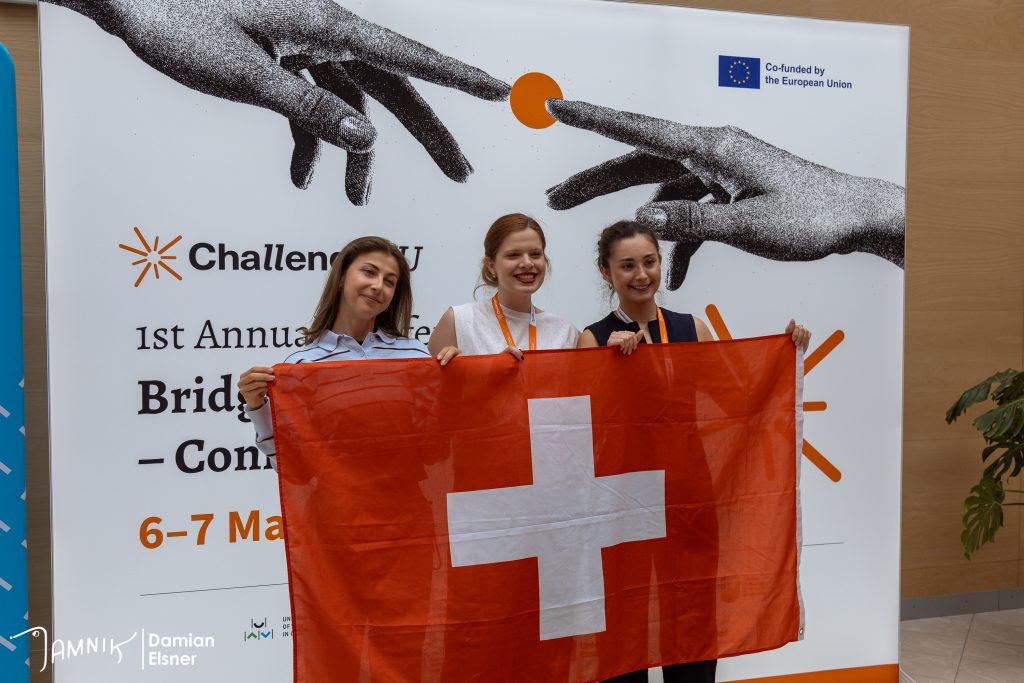 Three young woman with Switzerland flag