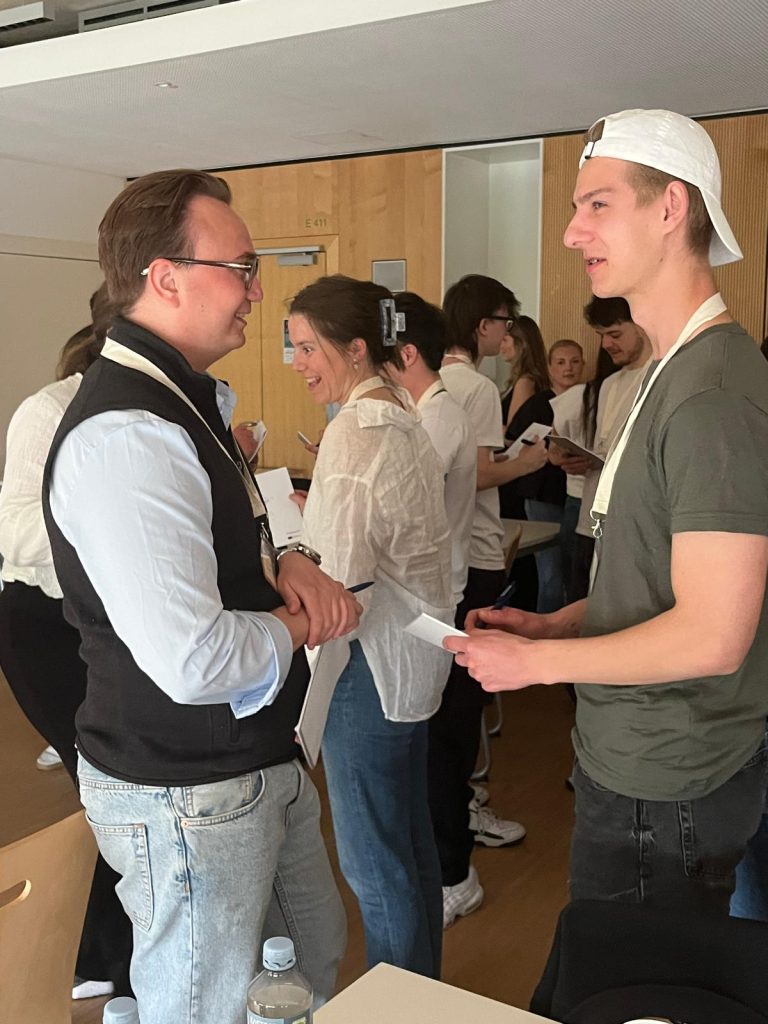 Students talk in pairs during a networking and collaboration activity.