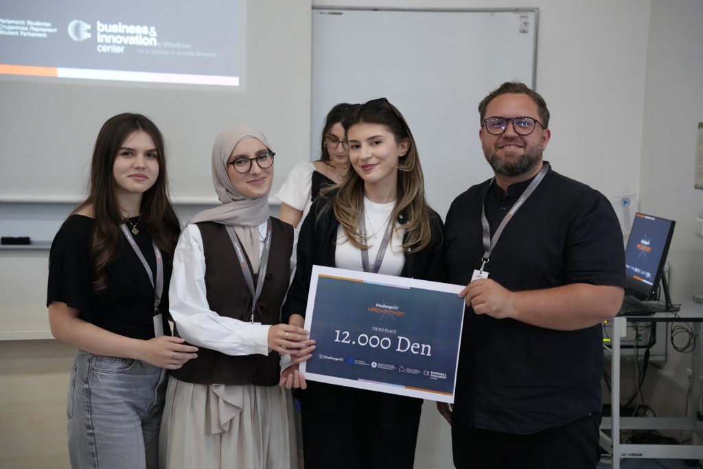 A student team and mentor pose with a third-place award certificate for 12,000 denars during the ChallengeEU Hackathon.