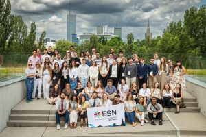 Group photo of EUSAF Conference 2026 participants with an ESN banner and the Warsaw skyline in the background.