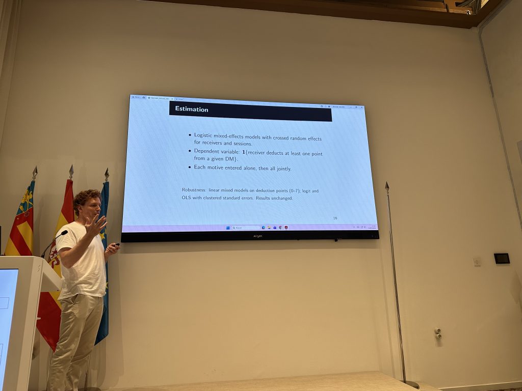 Researcher presenting statistical methods during a Behavioral Bridge summer school session.