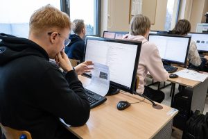 Students are sitting at computers